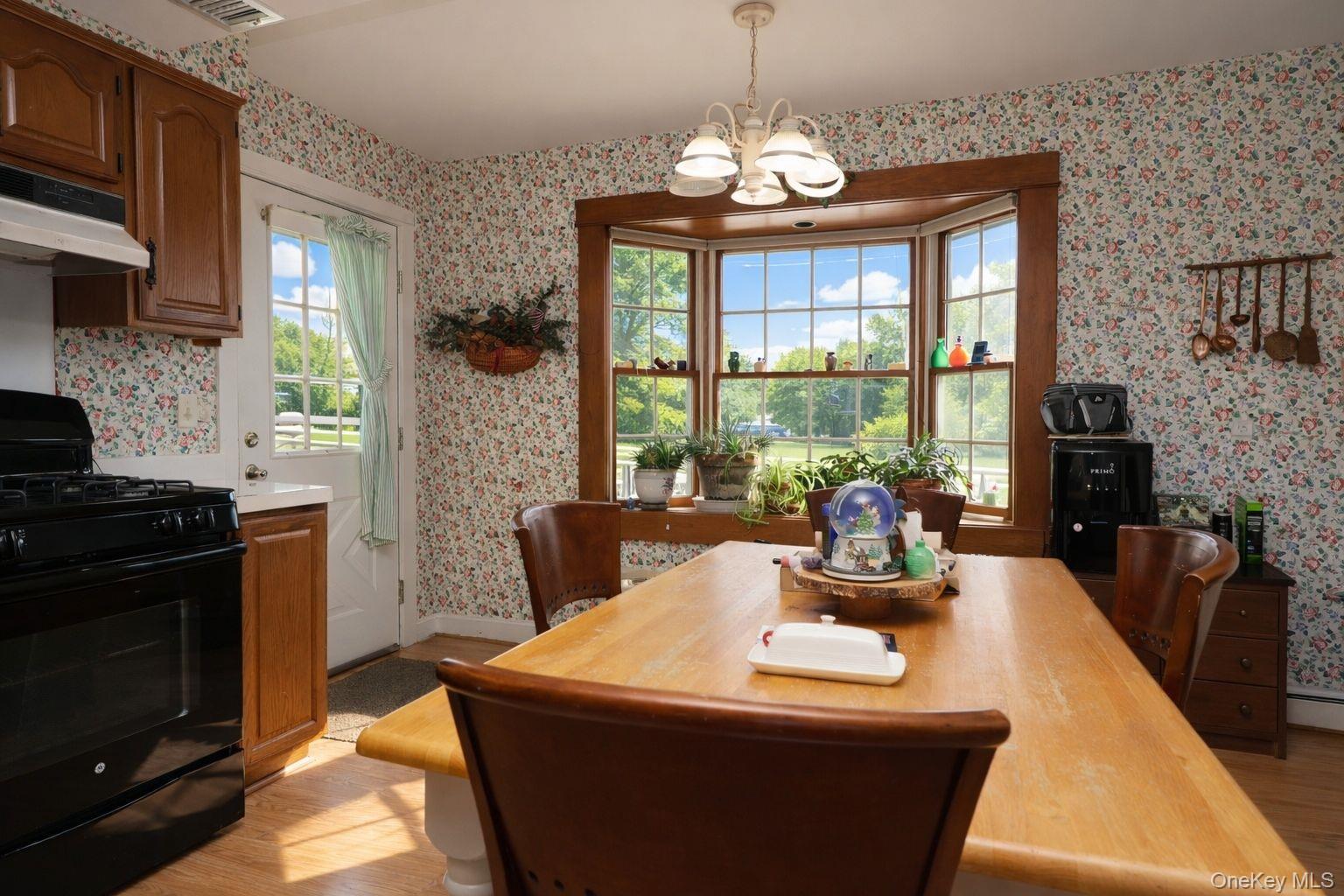 90 South Middletown Road Pearl River, NY 10965 - Photo 25 of 47 a view of a dining room with furniture a chandelier and large windows