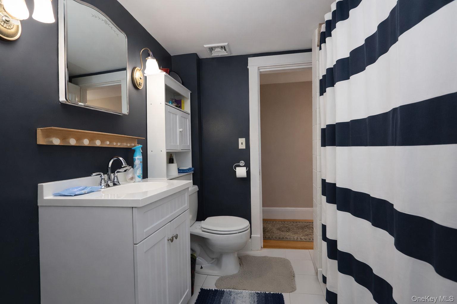 90 South Middletown Road Pearl River, NY 10965 - Photo 30 of 47 a bathroom with a sink a toilet a shower and a mirror