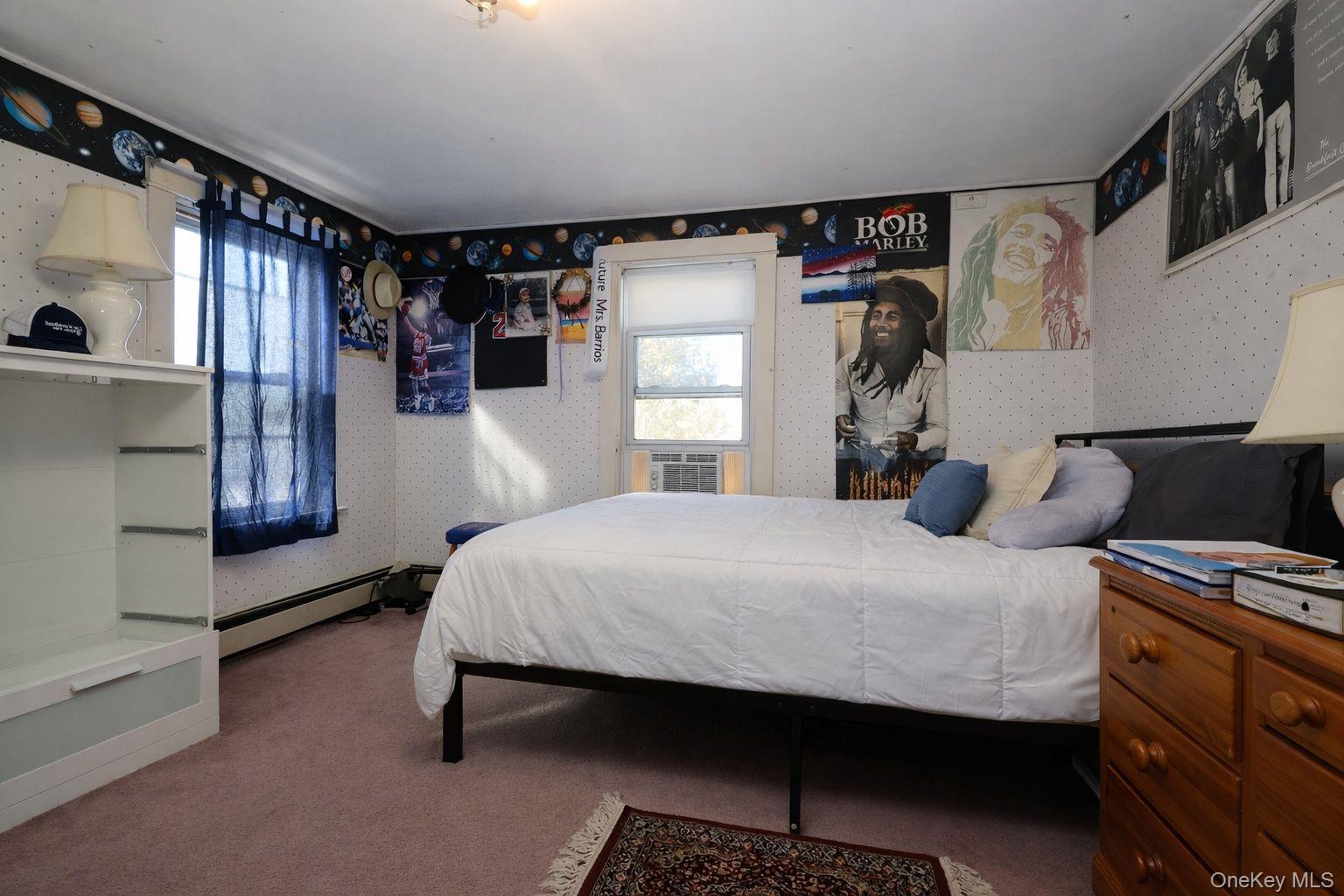 90 South Middletown Road Pearl River, NY 10965 - Photo 32 of 47 a bedroom with a bed and wooden floor