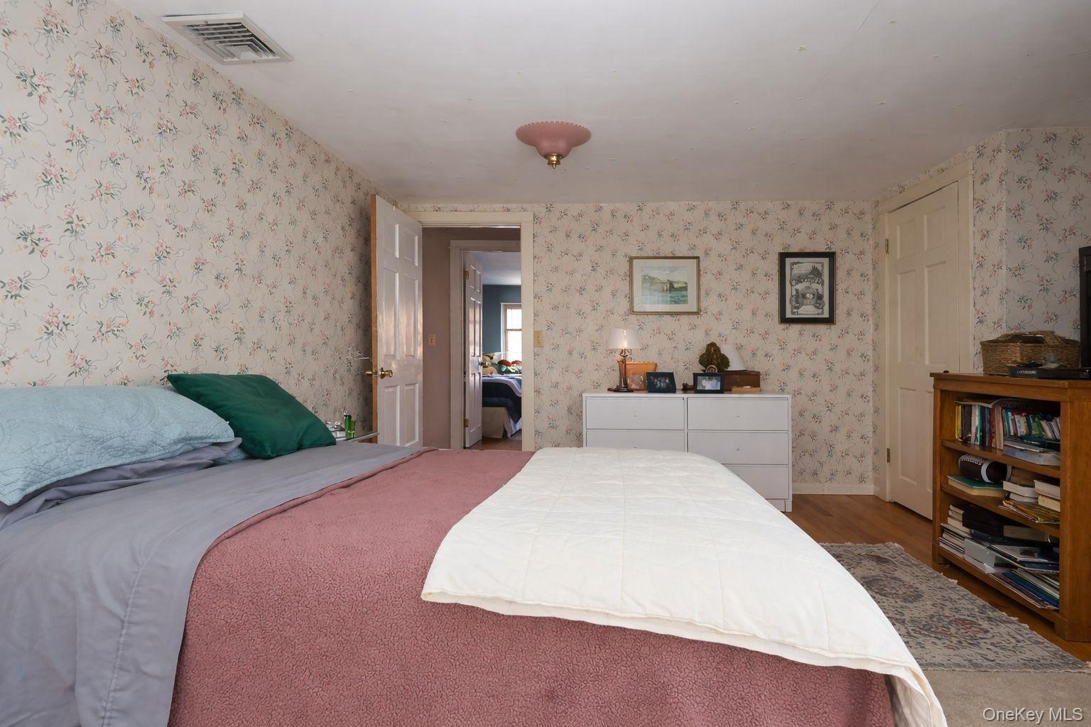 90 South Middletown Road Pearl River, NY 10965 - Photo 41 of 47 a bedroom with a bed and a book shelf