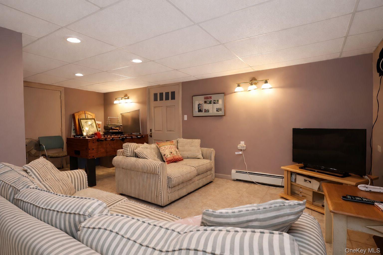 90 South Middletown Road Pearl River, NY 10965 - Photo 45 of 47 a living room with furniture and a flat screen tv