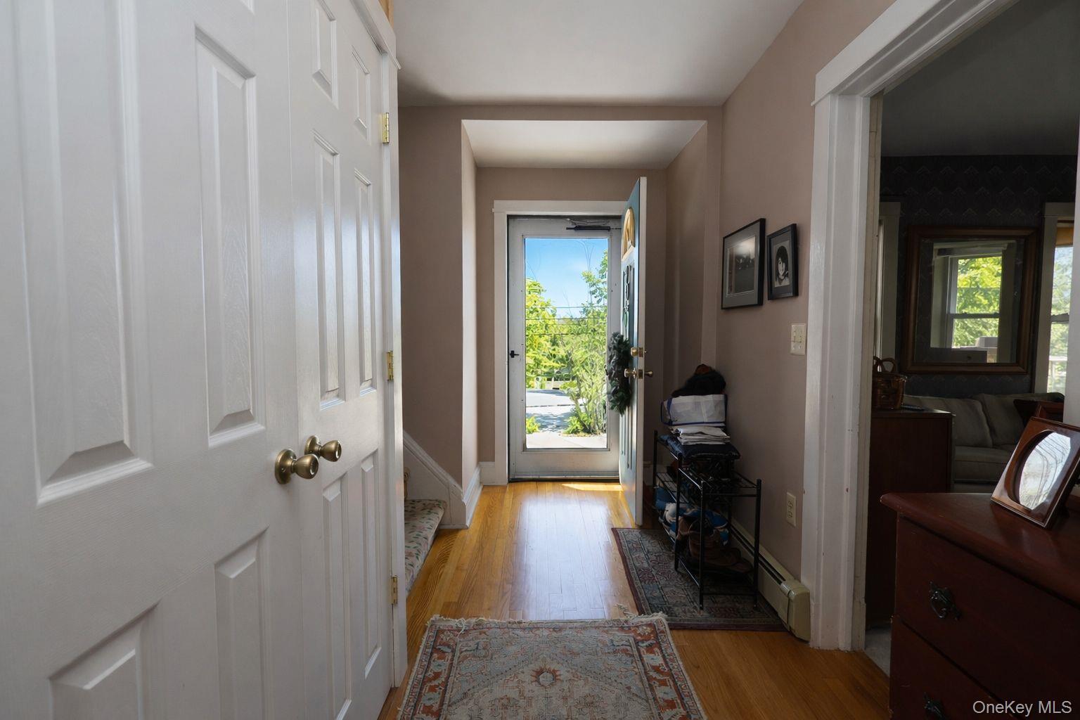 90 South Middletown Road Pearl River, NY 10965 - Photo 5 of 47 a view of a hallway with wooden floor and living room