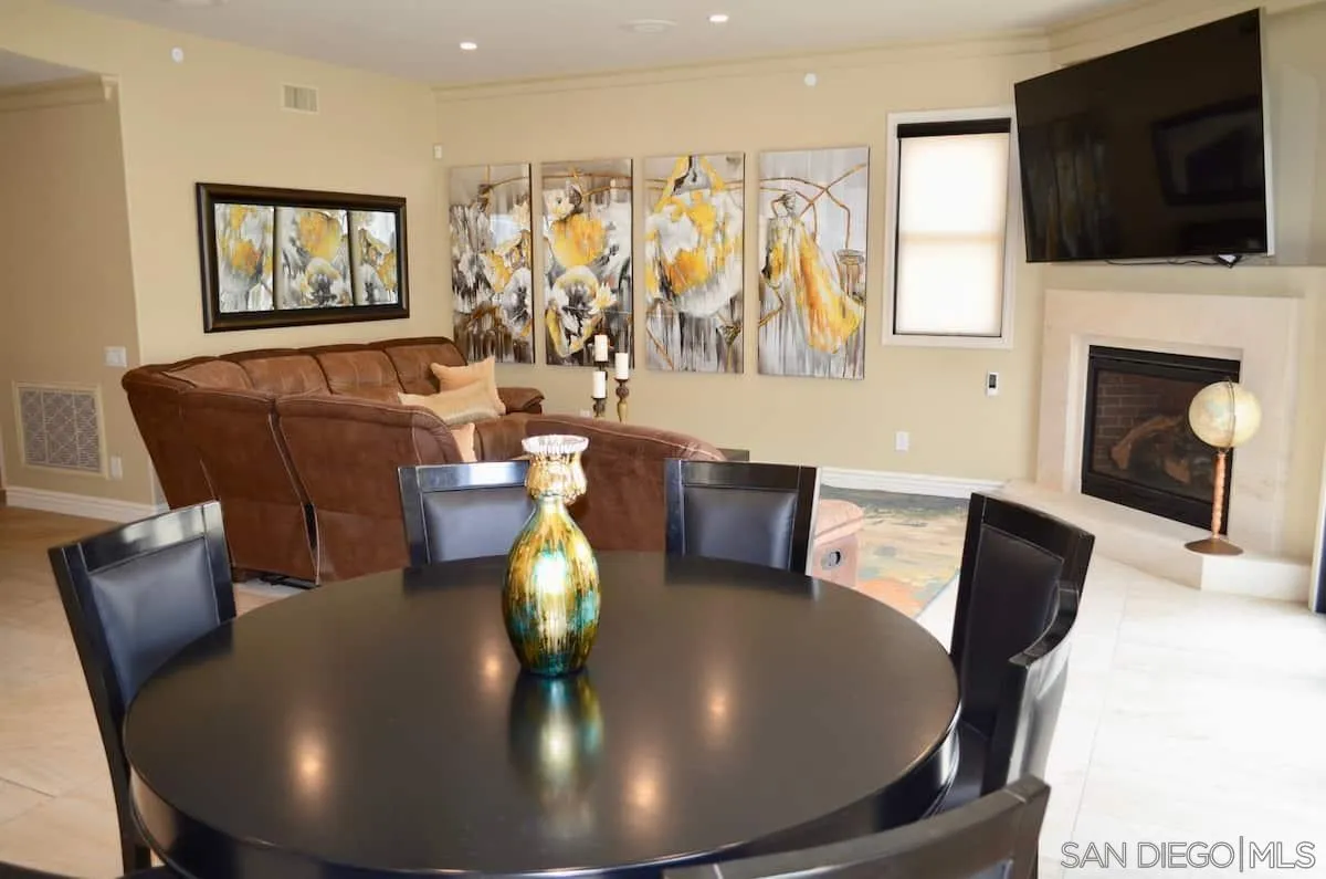 1235 Neptune Avenue Encinitas, CA 92024 - Photo 21 of 32 a living room with furniture fireplace and flat screen tv