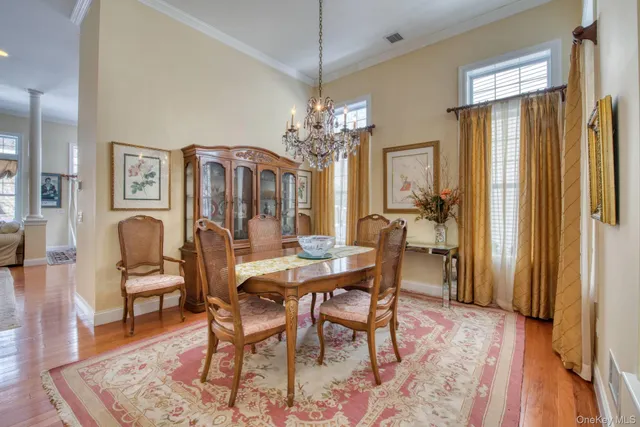 a view of a dining room with furniture and window