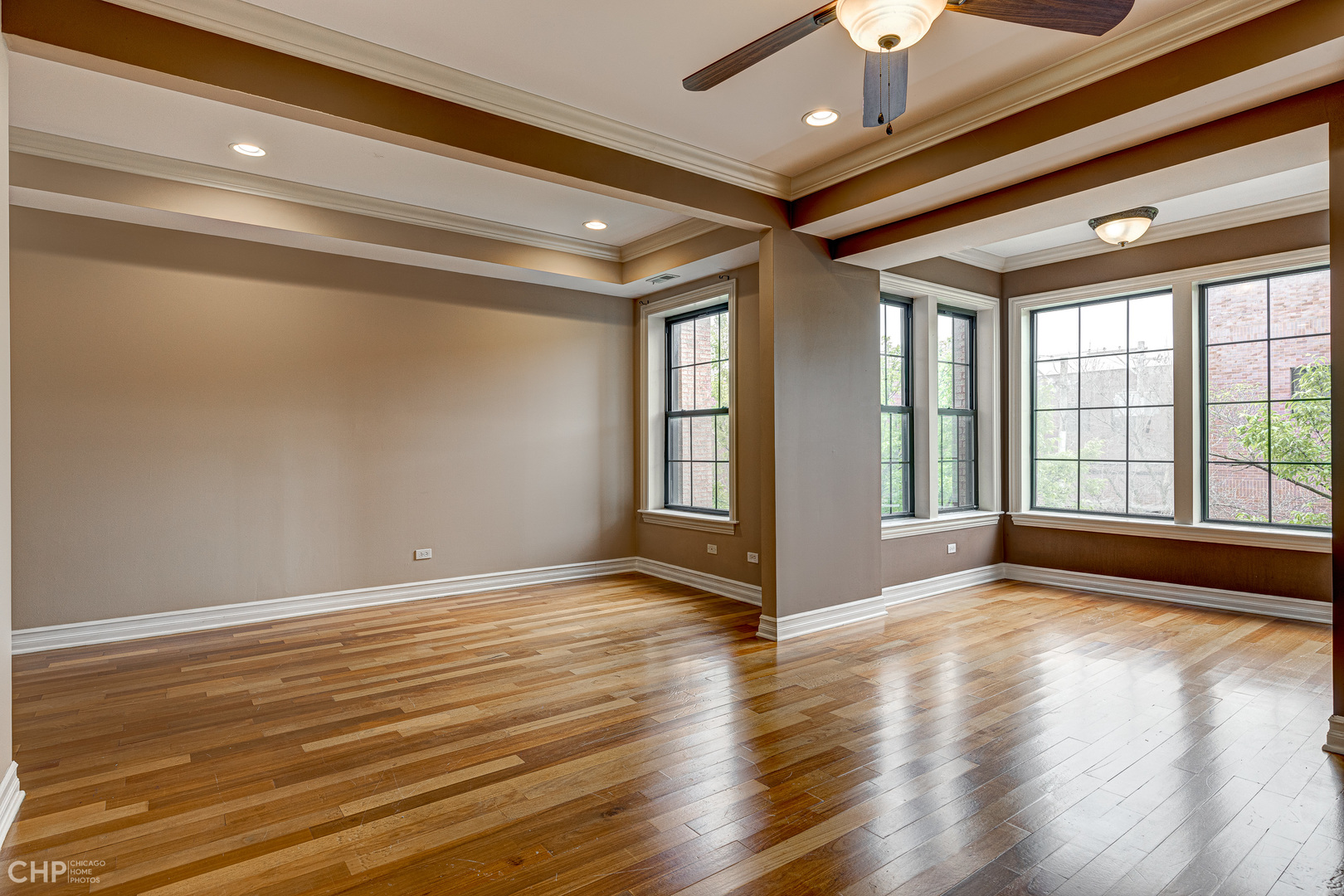 1363 East 64th Street, Unit 2 Chicago, IL 60637 - Photo 4 of 12 a view of an empty room with glass door and wooden floor
