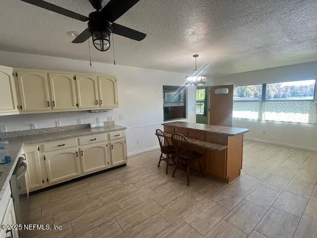 a kitchen with cabinets a sink and appliances