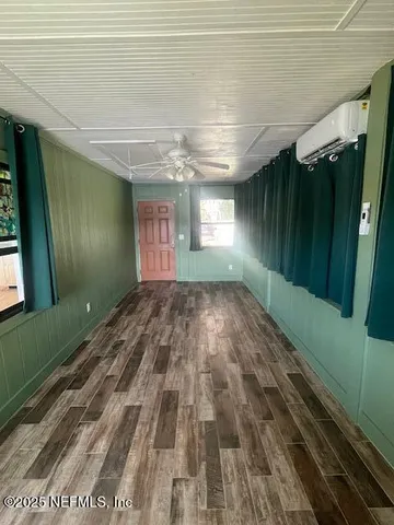 a view of hallway with stairs and chandelier
