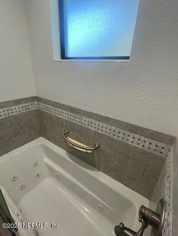 a bathroom with a bathtub