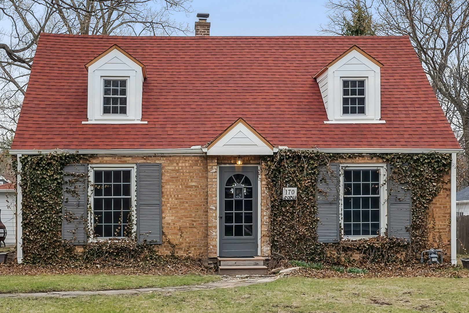 170 East Old Elm Road Lake Forest, IL 60045 - Photo 1 of 31 a front view of a house with garden