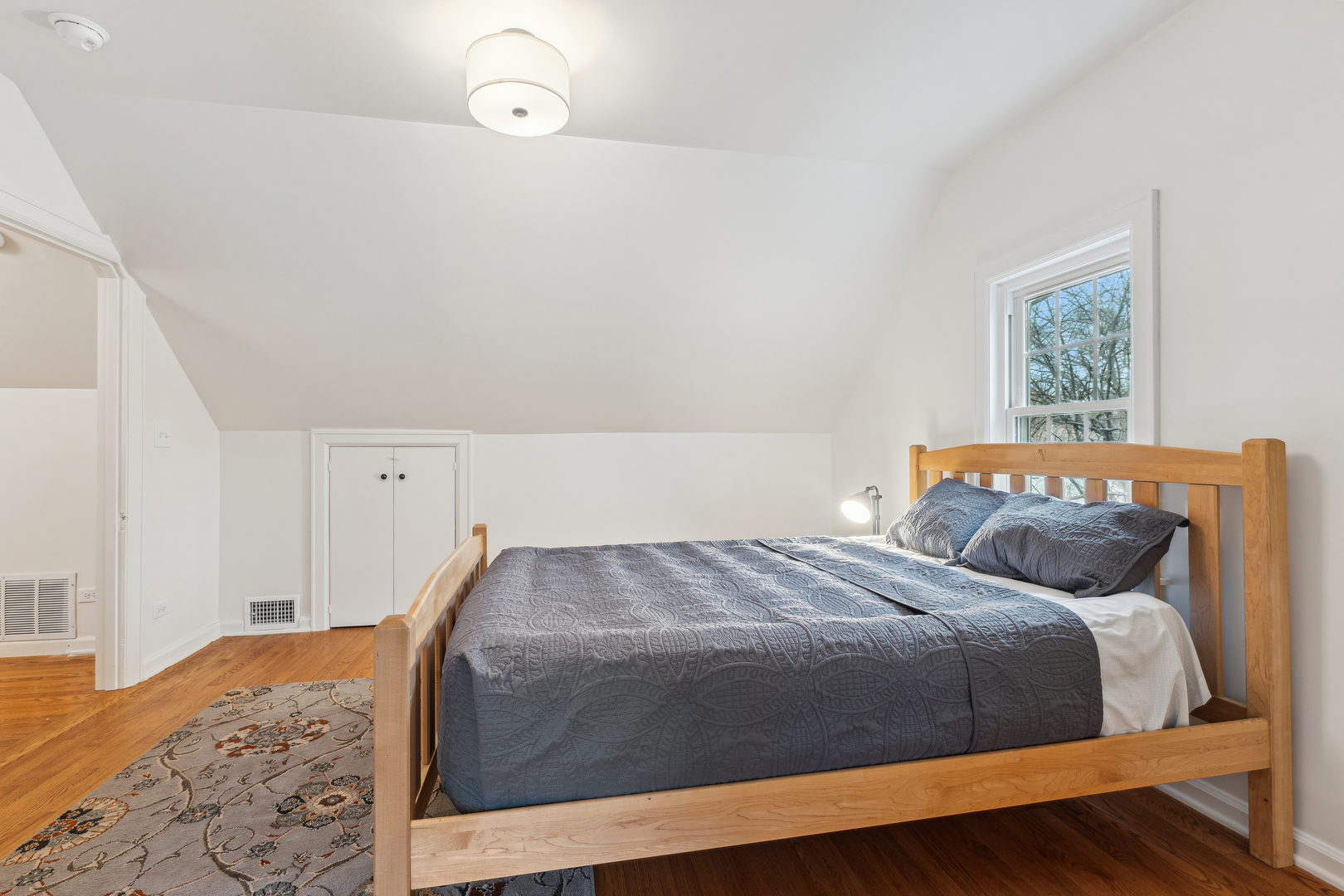 170 East Old Elm Road Lake Forest, IL 60045 - Photo 16 of 31 a bedroom with a bed and lamp