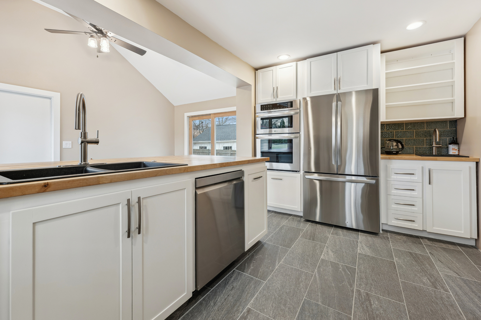 170 East Old Elm Road Lake Forest, IL 60045 - Photo 9 of 31 a kitchen with a refrigerator sink and cabinets
