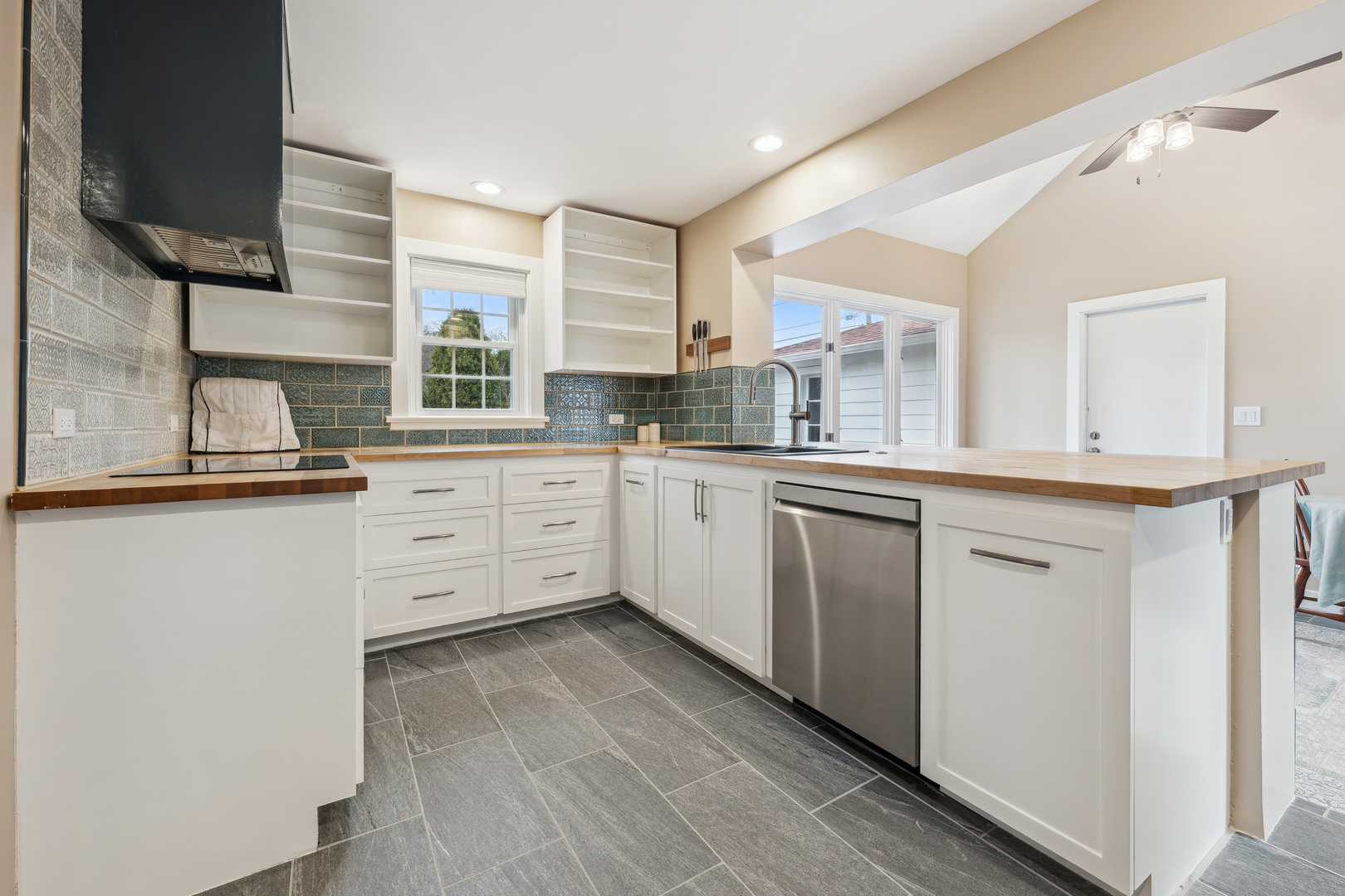 170 East Old Elm Road Lake Forest, IL 60045 - Photo 10 of 31 a kitchen with stainless steel appliances granite countertop a sink a stove and a refrigerator