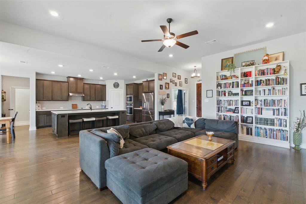 3385 Dps Tower Road Perrin, TX 76486 - Photo 11 of 35 a living room with furniture kitchen and a view of kitchen