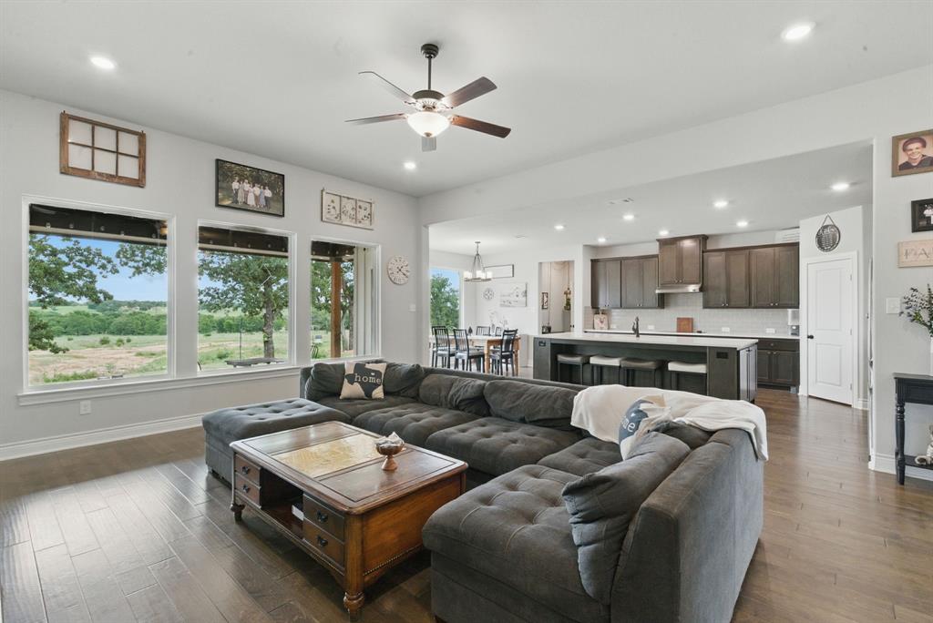 3385 Dps Tower Road Perrin, TX 76486 - Photo 12 of 35 a living room with furniture and a large window