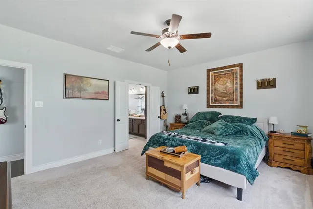 a bed room with a bed and a chandelier