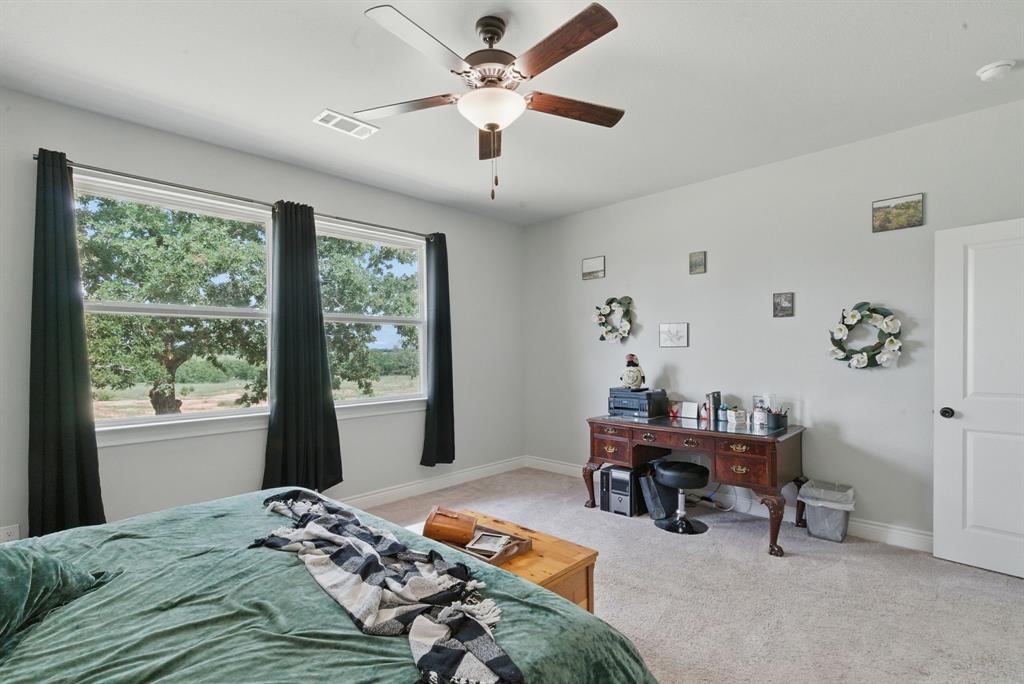 3385 Dps Tower Road Perrin, TX 76486 - Photo 21 of 35 a bedroom with a bed and a window