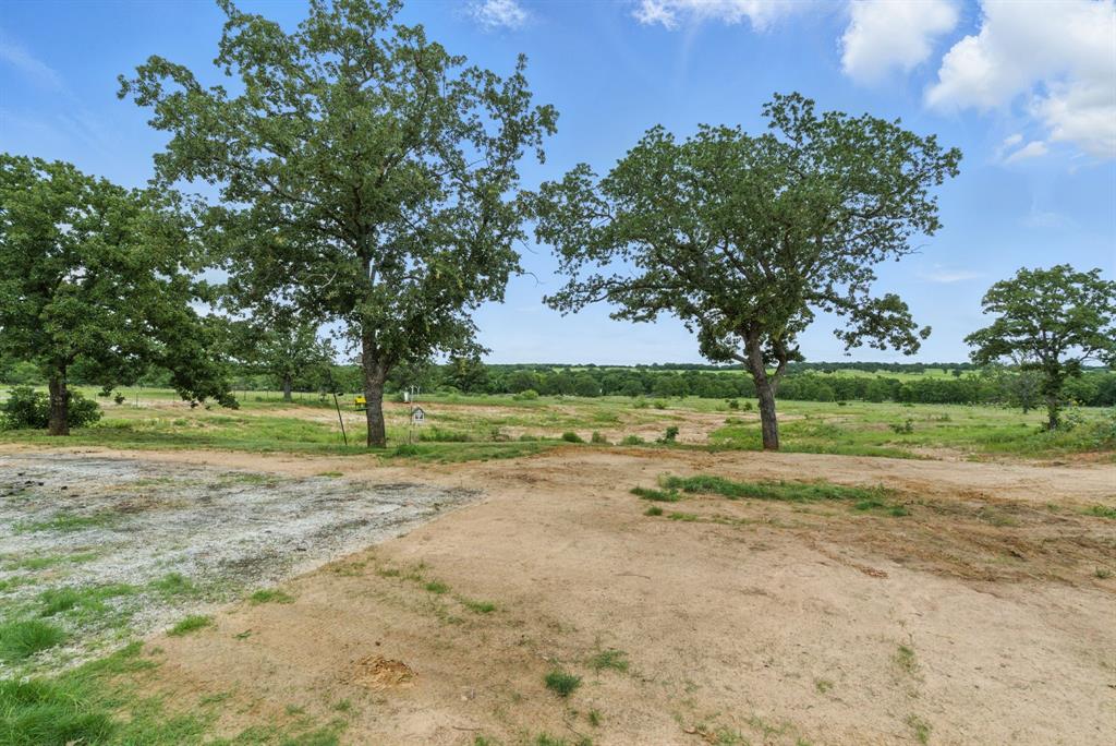 3385 Dps Tower Road Perrin, TX 76486 - Photo 3 of 35 a view of a field with trees