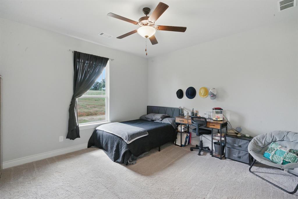 3385 Dps Tower Road Perrin, TX 76486 - Photo 33 of 35 a bedroom with bed and a window