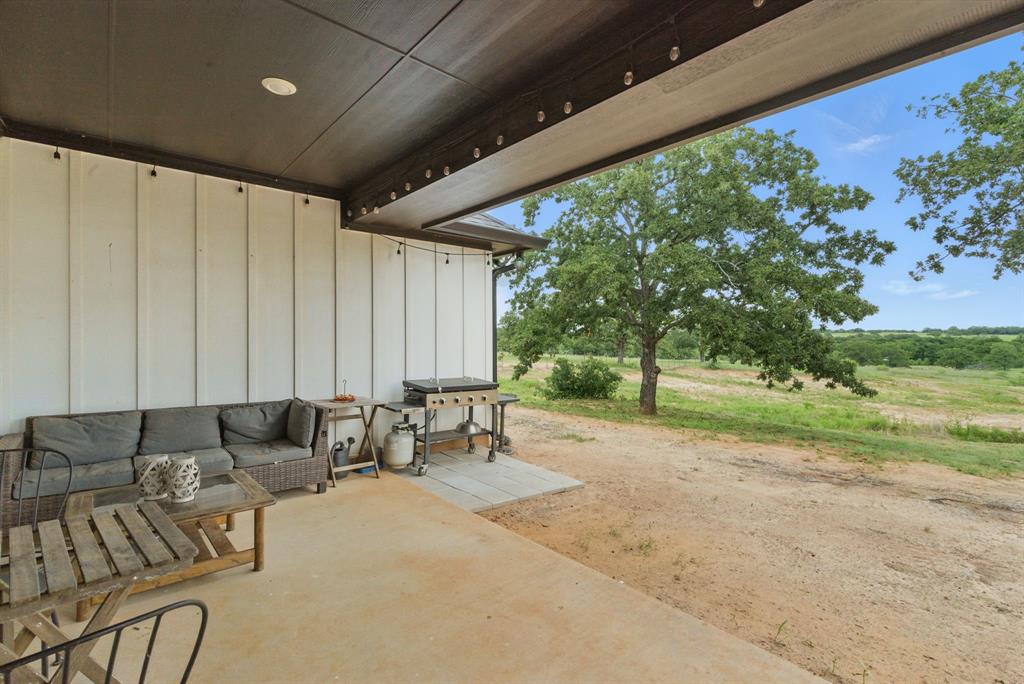 3385 Dps Tower Road Perrin, TX 76486 - Photo 4 of 35 a living room with patio