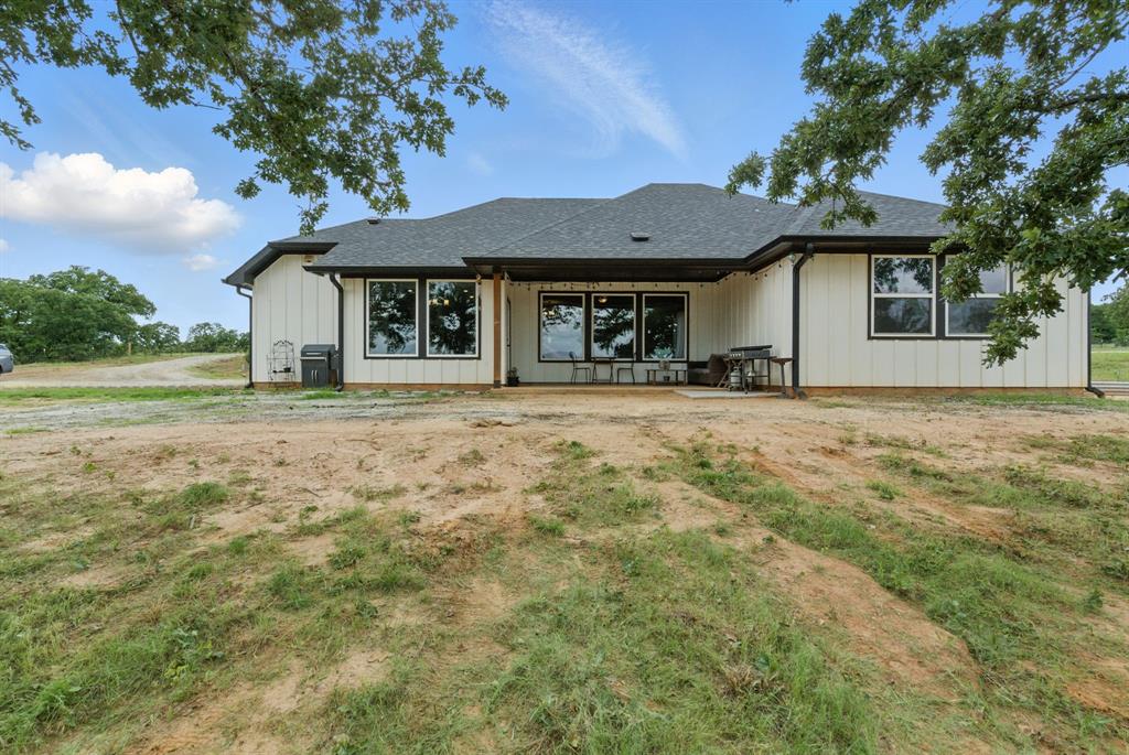 3385 Dps Tower Road Perrin, TX 76486 - Photo 6 of 35 a house with trees in the background