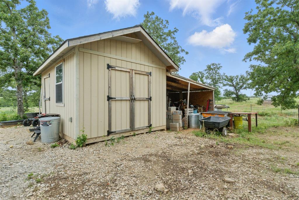 3385 Dps Tower Road Perrin, TX 76486 - Photo 8 of 35 a backyard of a house with table and chairs
