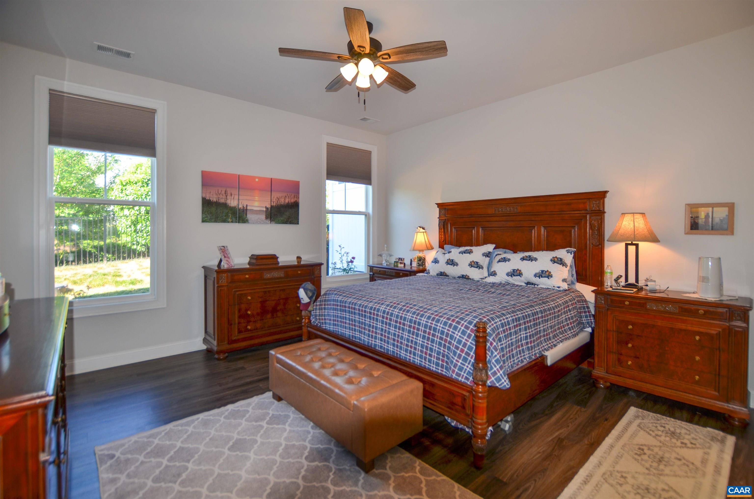 327 Claibourne Road Crozet, VA 22932 - Photo 20 of 36 a bedroom with a bed and wooden floor