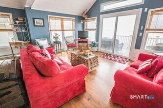 127 Shore Road Clinton, CT 06413 - Photo 11 of 20 a living room with furniture and a large window