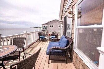 127 Shore Road Clinton, CT 06413 - Photo 16 of 20 a view of balcony with wooden floor and seating