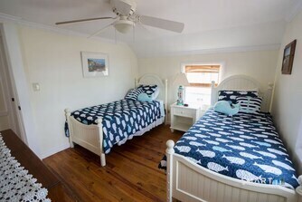 127 Shore Road Clinton, CT 06413 - Photo 20 of 20 a bedroom with a bed and wooden floor