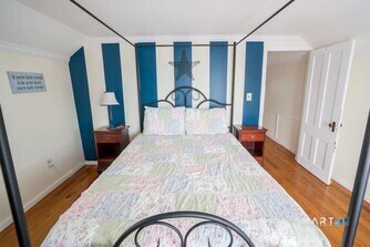 127 Shore Road Clinton, CT 06413 - Photo 2 of 20 a bedroom with a bed and a mirror