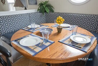 127 Shore Road Clinton, CT 06413 - Photo 3 of 20 a workspace with furniture and wooden floor