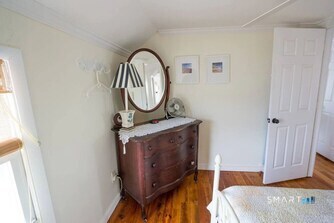 127 Shore Road Clinton, CT 06413 - Photo 6 of 20 a view of living room with furniture and a mirror
