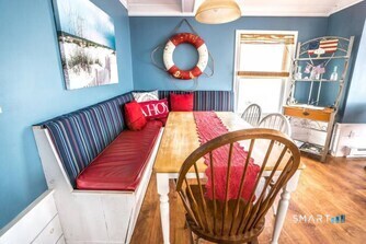 127 Shore Road Clinton, CT 06413 - Photo 7 of 20 a view of a couches with wooden floor