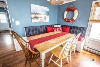 127 Shore Road Clinton, CT 06413 - Photo 10 of 20 a view of a dining room with furniture and wooden floor