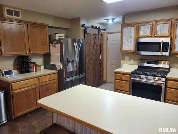 a kitchen with a refrigerator a stove a sink and dishwasher