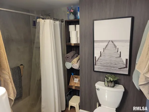a bathroom with a shower and a tub