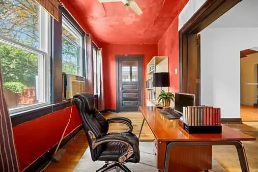 a dining room with furniture and wooden floor