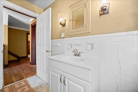 a bathroom with a sink and a mirror