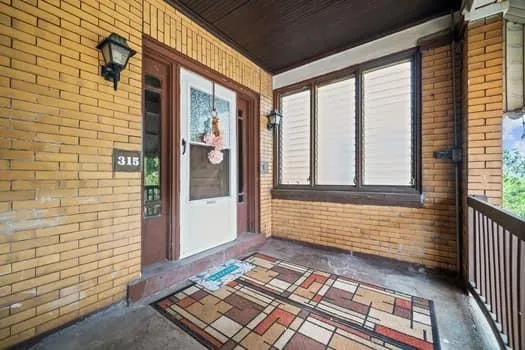 a view of a brick house with outdoor space