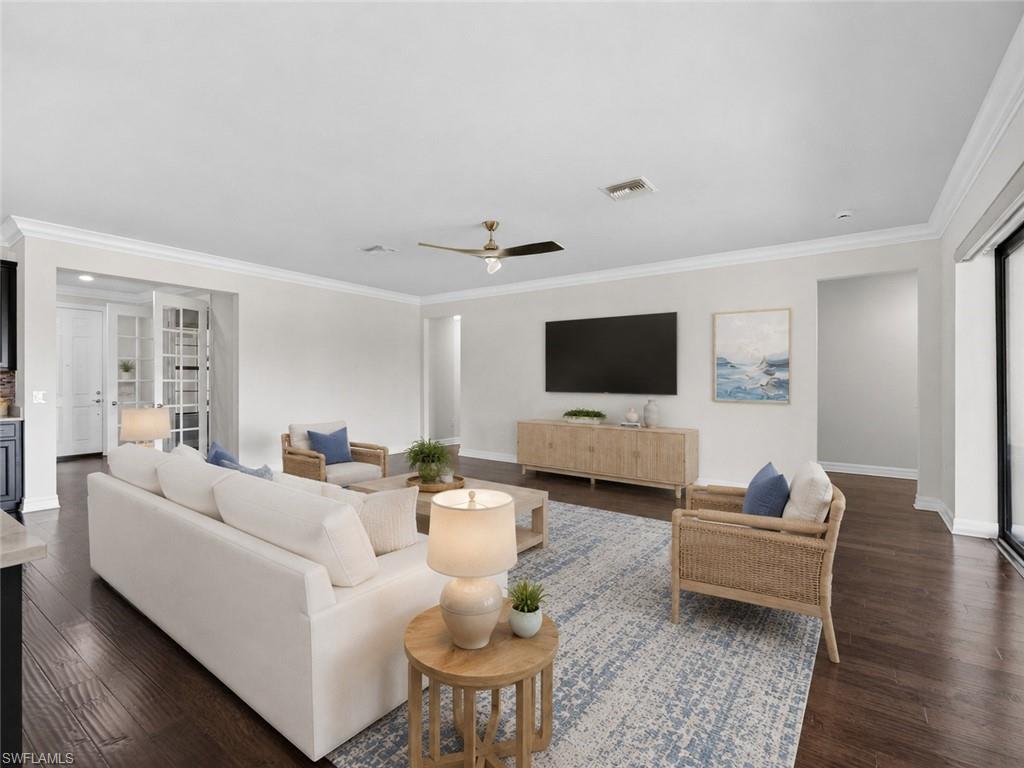 6124 Victory Drive Ave Maria, FL 34142 - Photo 8 of 50 a living room with furniture and a flat screen tv