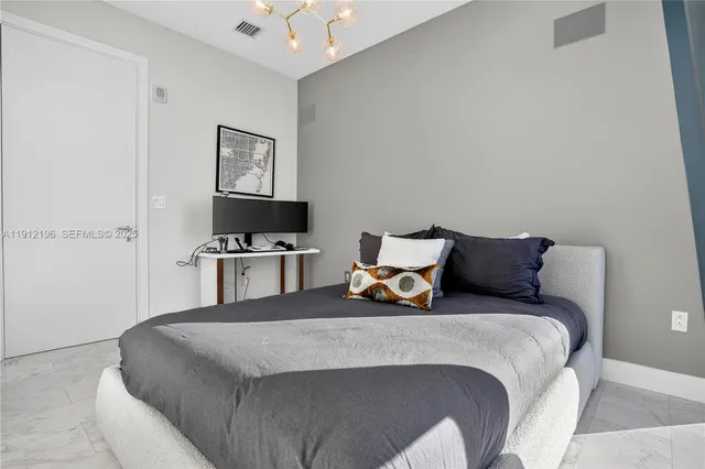 a large white kitchen with a large window