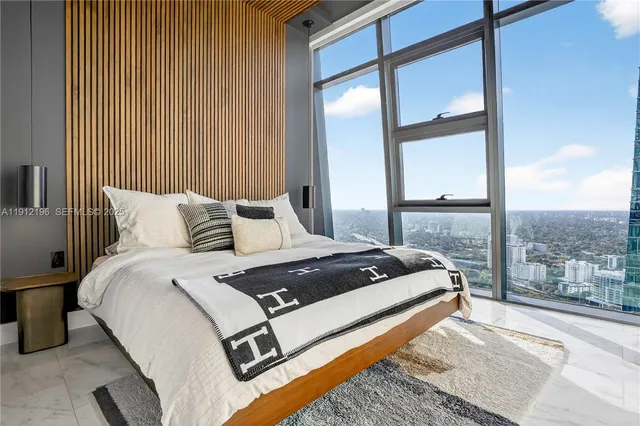 a bathroom with a sink and mirror with toilet