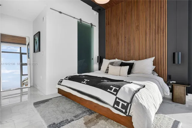 a living room with furniture flowerpot and a couch