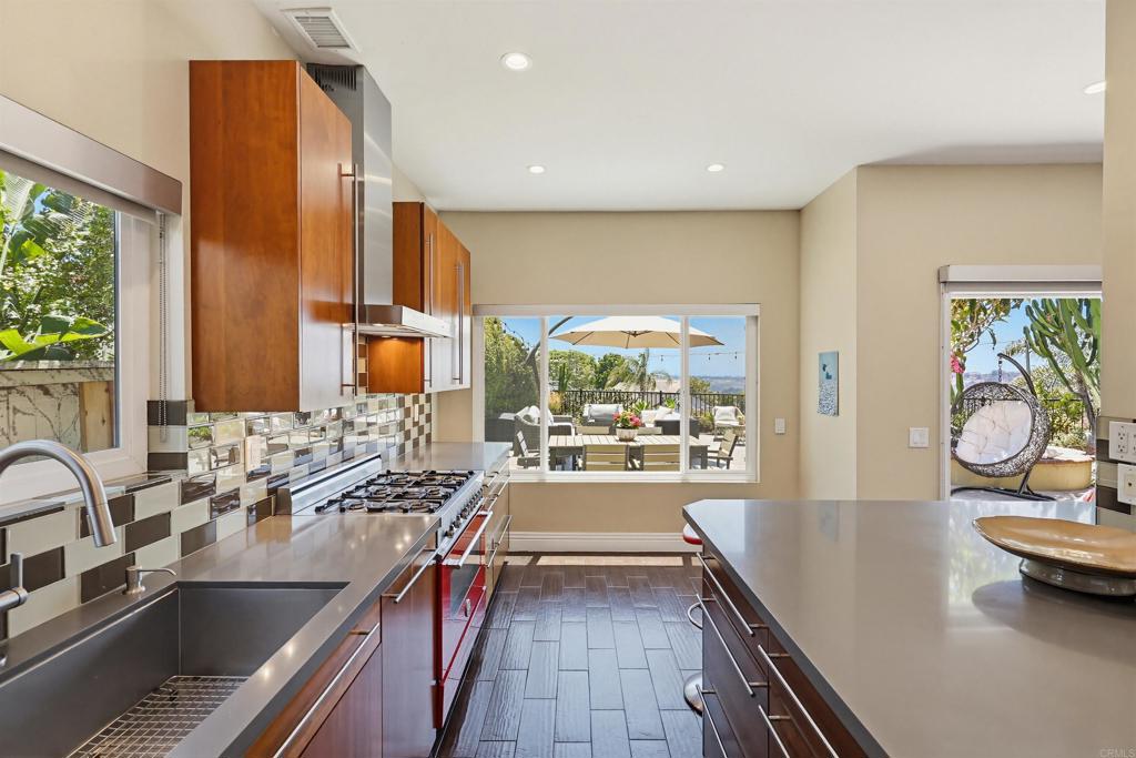 2756 Southampton Road Carlsbad, CA 92010 - Photo 15 of 40 a kitchen with counter top space and wooden floor