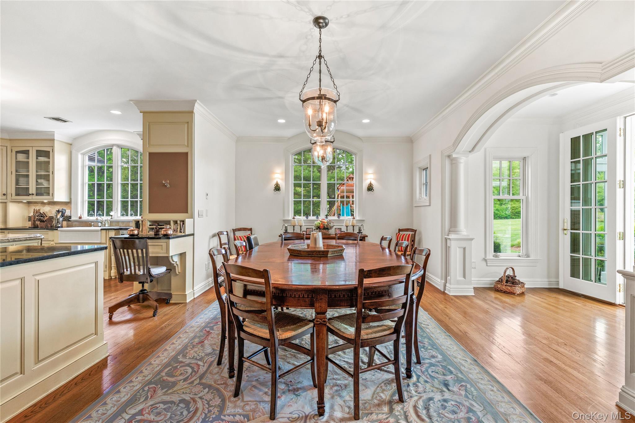 63 Old Mill River Road Pound Ridge, NY 10576 - Photo 10 of 47 a dining room with furniture a chandelier and wooden floor