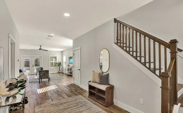 a front view of a house with a garden