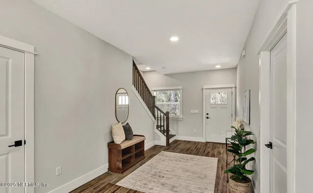 an aerial view of a house with a garden and swimming pool
