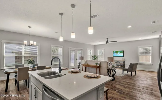 a bathroom with double sink and a mirror