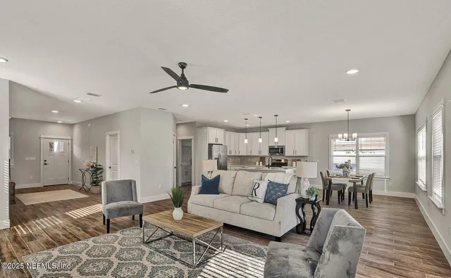 a bathroom with a tub shower and mirror