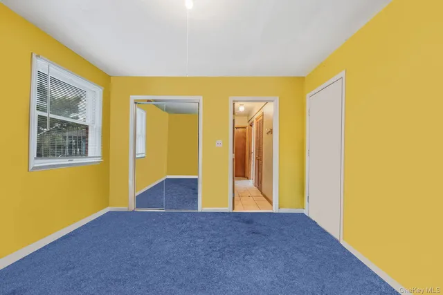 a view of game room with window and couch